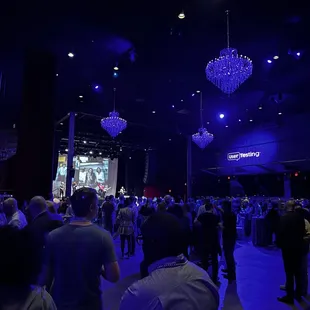 a crowd of people at a convention