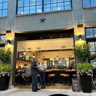 View from outdoor dining of the open garage door