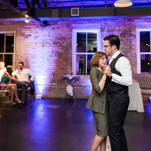 Beautiful uplighting adds ambiance to any occasion and highlights the beautiful exposed brick. Photo courtesy: Amanda Jameson Weddings