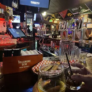 a beer being poured at a bar