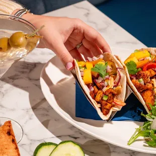 Blackened red fish tacos with ancho chile slaw, mango pico and cilantro