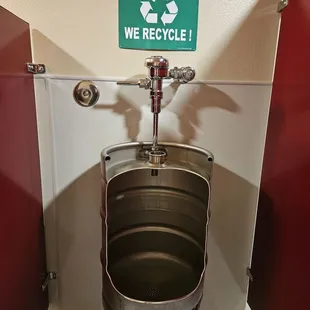 Awesome urinal made of a keg. Not sure what they recycle...