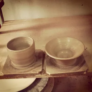 Here are the two bowls that I made with my very first pottery lesson! How fun! This is them wet; still need to glaze/fire them.