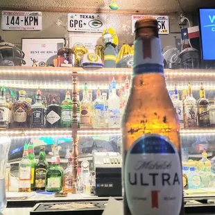 a beer bottle on the bar