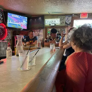 people sitting at the bar