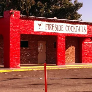 a fire hydrant in front of a red building