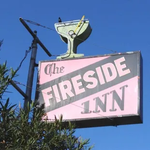 a neon sign for the fireside inn
