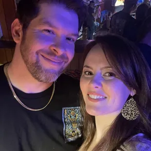 a man and a woman posing for a picture