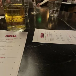 a glass of beer on a table