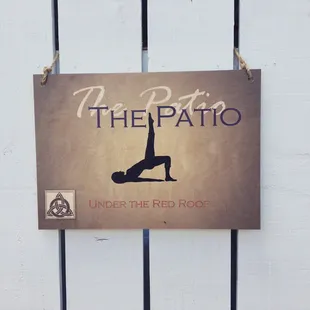 Patio sign for our Pilates Mat &amp; Barre class on the patio at The Firm Pilates