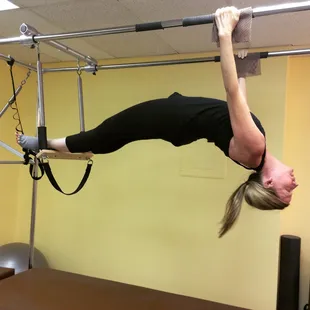 Hanging back on the Cadillac in a private Pilates session