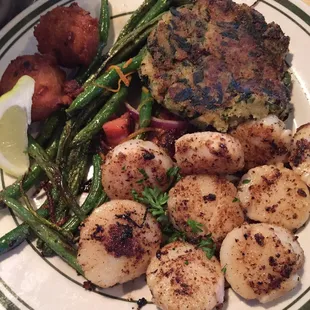 Seared sea scallops and the spinach cake were awesome I've never had a spinach cake but it was absolutely delicious