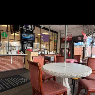 Tables on the covered patio part of the restaurant