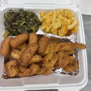 Fried flounder, skrimps, collards, mac n cheese and hush puppies