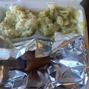 Potato salad, cabbage, rice and gravy