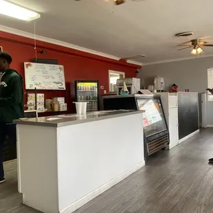 two men standing at the counter