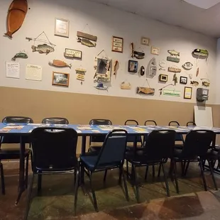 a long dining table with chairs