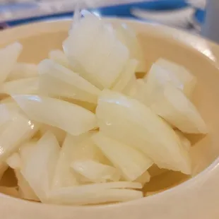 a bowl of sliced onions