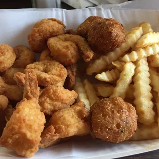 Friday special, shrimp dinner with hush puppies, fries and coleslaw. Delicious and a lot of shrimp.
