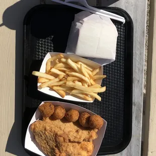 Cod platter- 3 pieces of fish with two sides. We went with hush puppies and fries