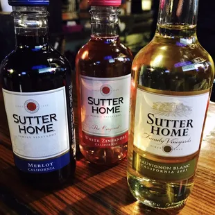 three bottles of sutter home syrup