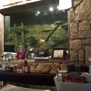 The big fish tank behind the bar