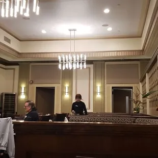 two men sitting at a table in a restaurant