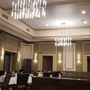 a dining room with tables and chairs