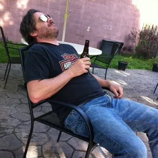 Zuk enjoys the patio. And drinking alone.