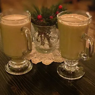 two glasses of coffee on a table