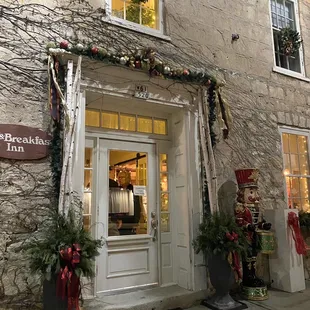 the front of a building decorated for christmas