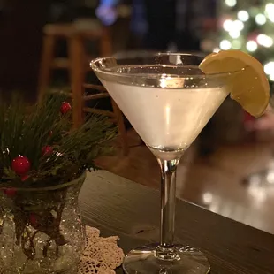 a martini with a lemon wedge