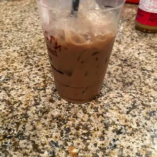 a drink in a plastic cup