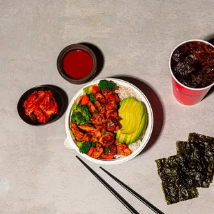 a bowl of food and chopsticks