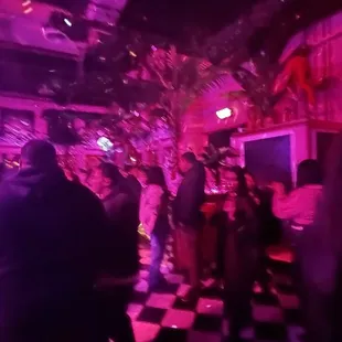 a crowd of people at a bar