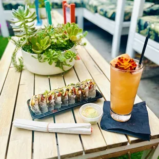 Happy Hour 4-7pm M-Fr. $20 grapefruit Paloma with the Flamingo roll deal