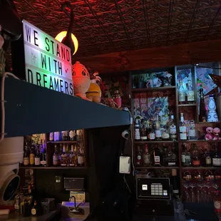 a neon sign above the bar