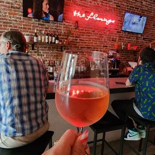 a person holding a glass of wine