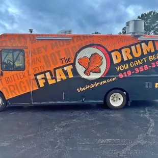 an orange and black food truck