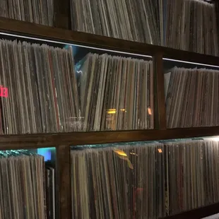 a wall of records in a record store