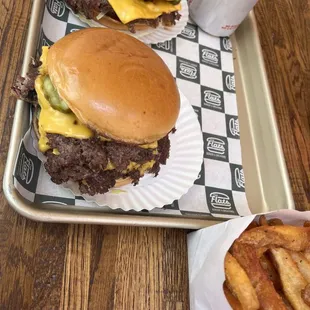 Single cheeseburger, Double cheeseburger, and fries