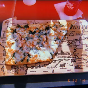 wooden board the pizza was served on was shaped as the state of PA &amp; had all the different areas carved out