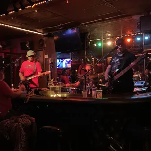 a band playing at a bar