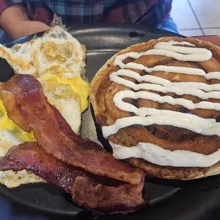 Cinna roll pancakes with eggs and bacon