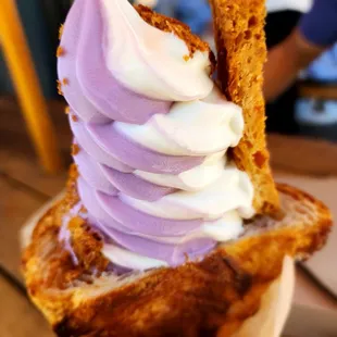 Ube/vanilla soft serve on a croissant cone