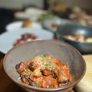 Lamb meatballs made with moroccan spices, sauce bravas, medjool date, and pickled white fig.