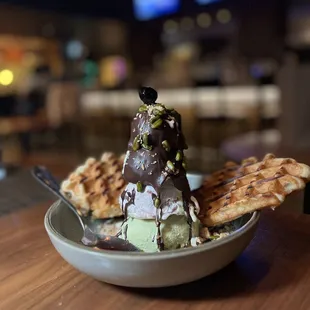 Italian pistachio cherry gelato sundae that is prepared table side.