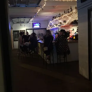 people sitting at the bar
