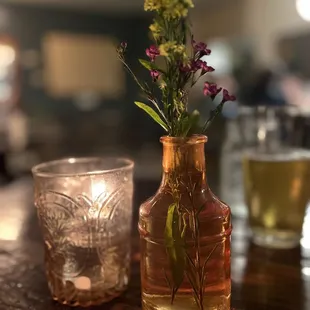 a glass vase with flowers in it