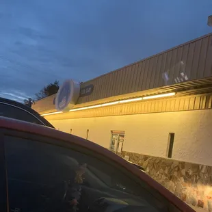 a car parked in front of a restaurant
